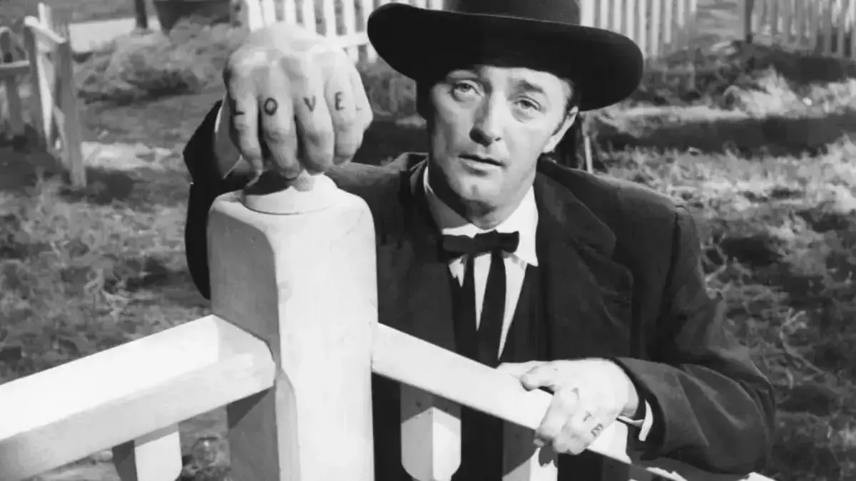 Pòster o pantalla de projecció amb el títol ‘La noche del cazador’ de Charles Laughton
